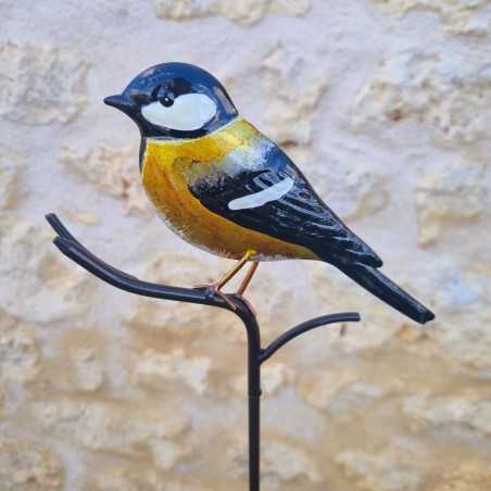 Uccello decorativo su picchetto giallo