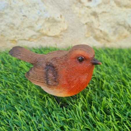 Uccello in resina rossa