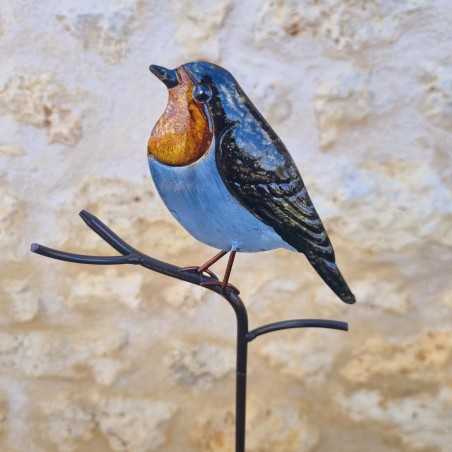 Uccello decorativo su picchetto arancione