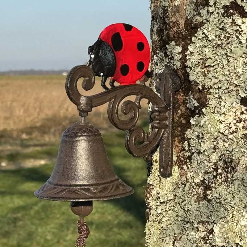 Campana da parete in ghisa con motivo coccinella vista laterale