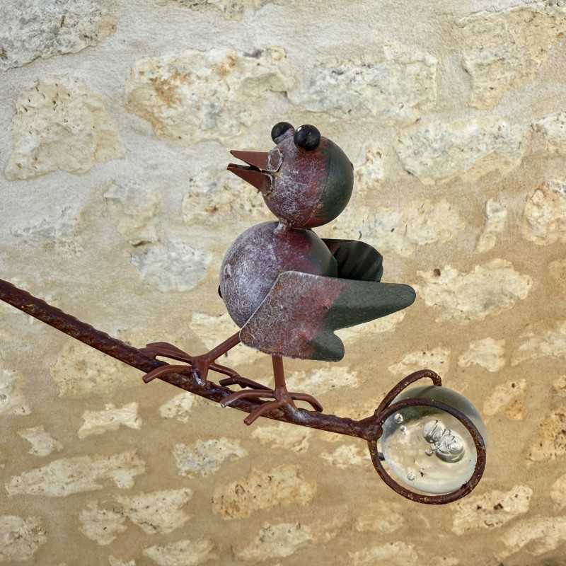 Mobile per uccelli in metallo patinato vista del contrappeso in vetro